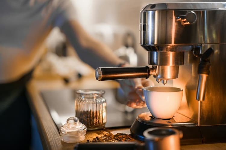 A coffee grinder preparing fresh grounds for brewing